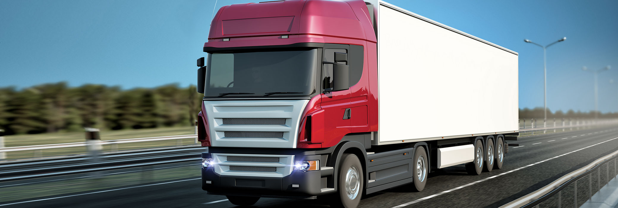 A red and white truck driving on the highway
